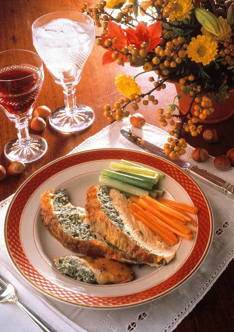 Slices of stuffed capon with vegetables and wine
