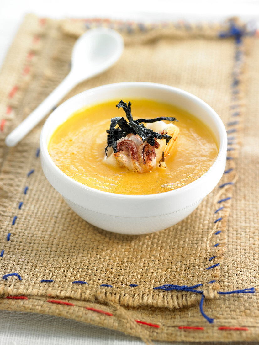 Cream of pumpkin soup with squid