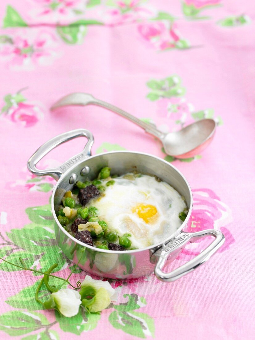 Black Butifarra, pea and egg casserole