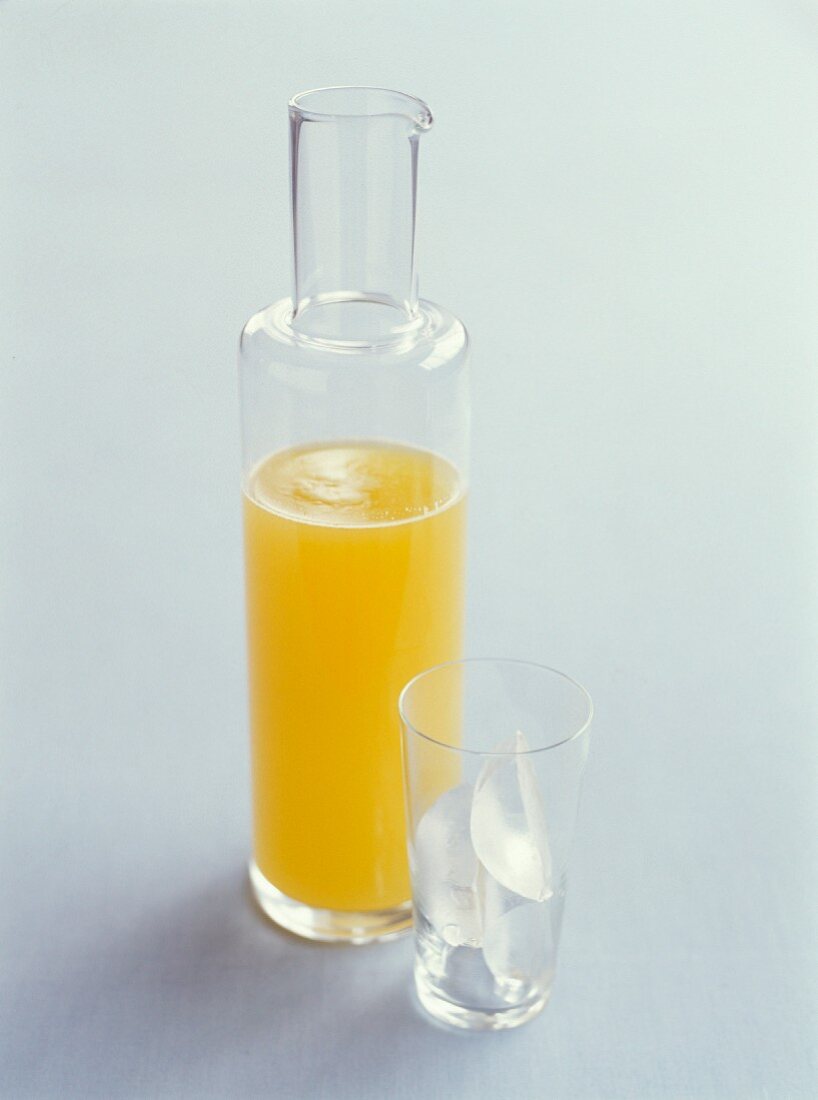 A caraffe with orange juice