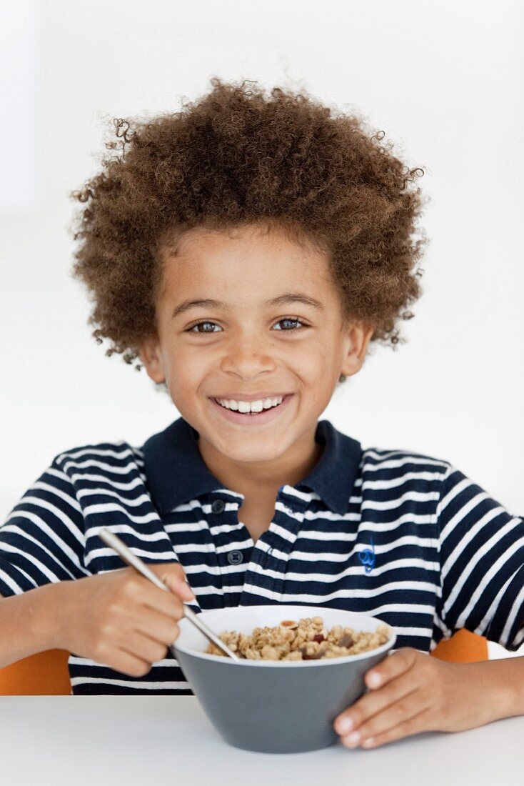 Boy eating a bowl of cereals