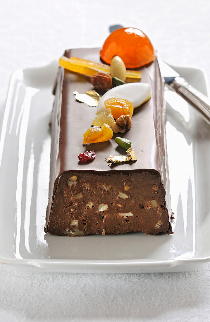 Chocolate,Calisson,dried fruit and candied fruit log cake