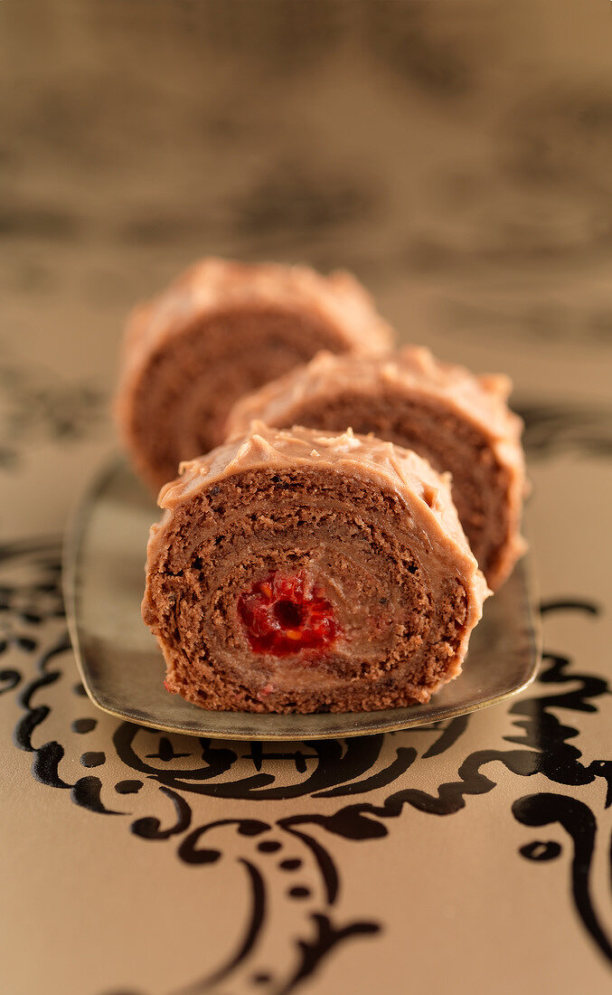 Chocolate and raspberry rolled log cake