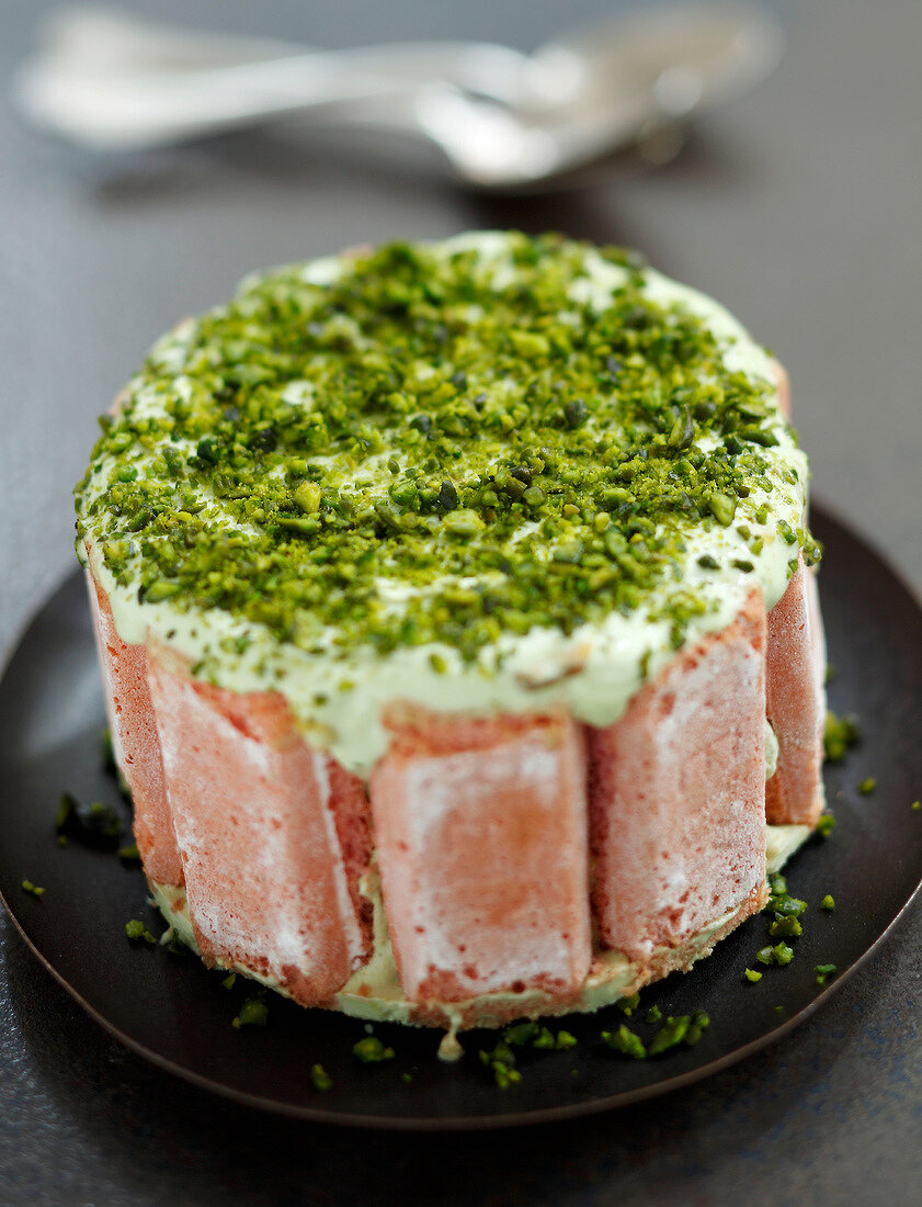 Pink Vacherin coated with crushed pistachios