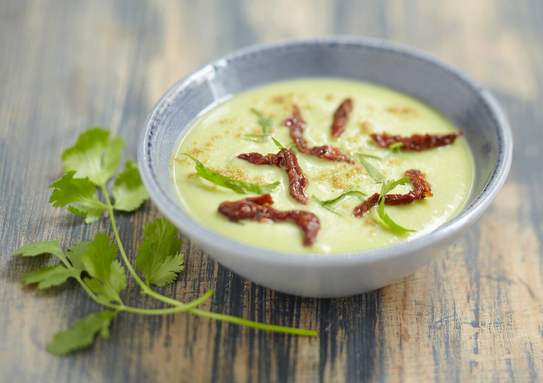 Cream of broad bean soup with coriander and sun-dried tomatoes