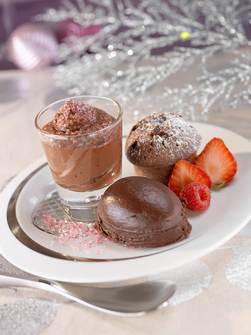 Three chocolate desserts :mousse, fondant and ice cream