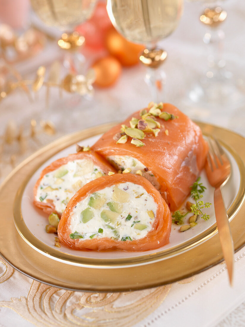 Seafood roll stuffed with goat's cheese, avocado and pistachios