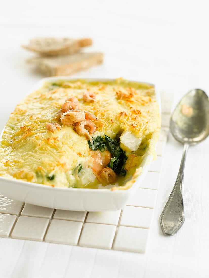 Fish,spinach and shrimp cheese-topped dish