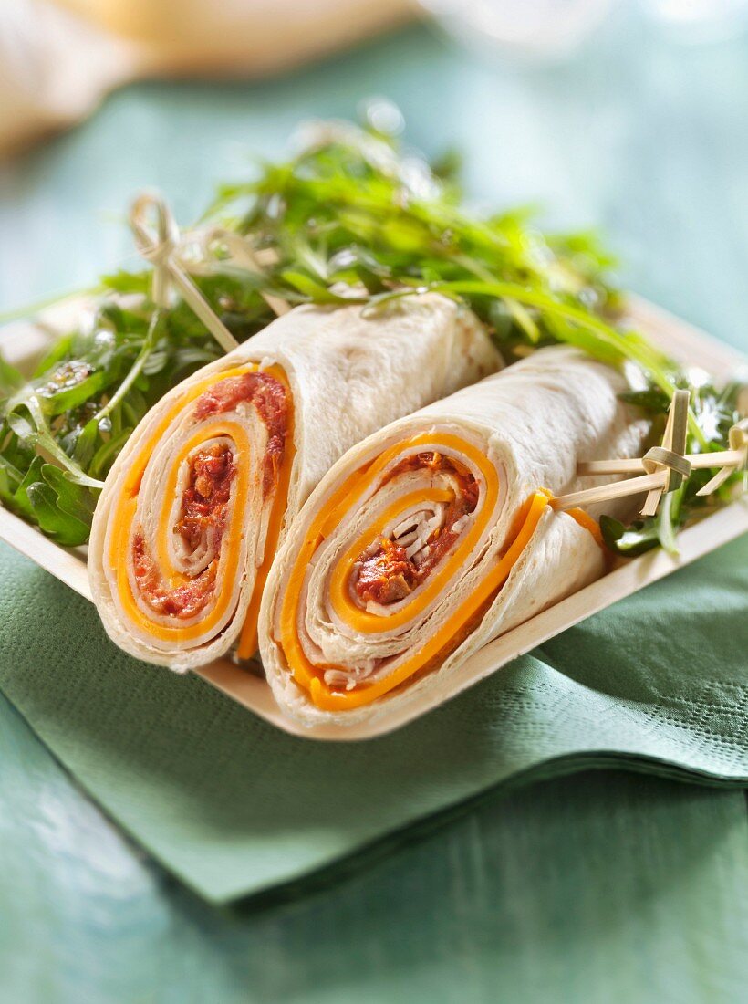 Preserved tomato and Edam wrap served with rocket lettuce