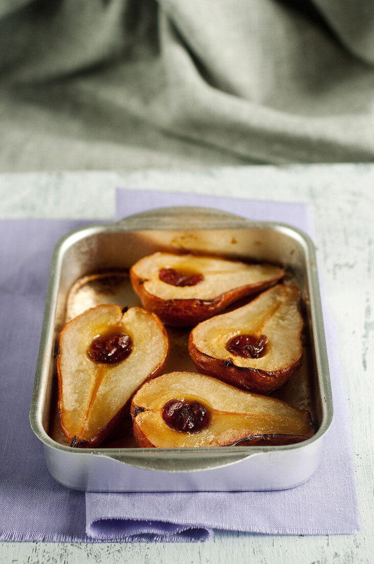 Roast pears with maple syrup ,dried cranberries