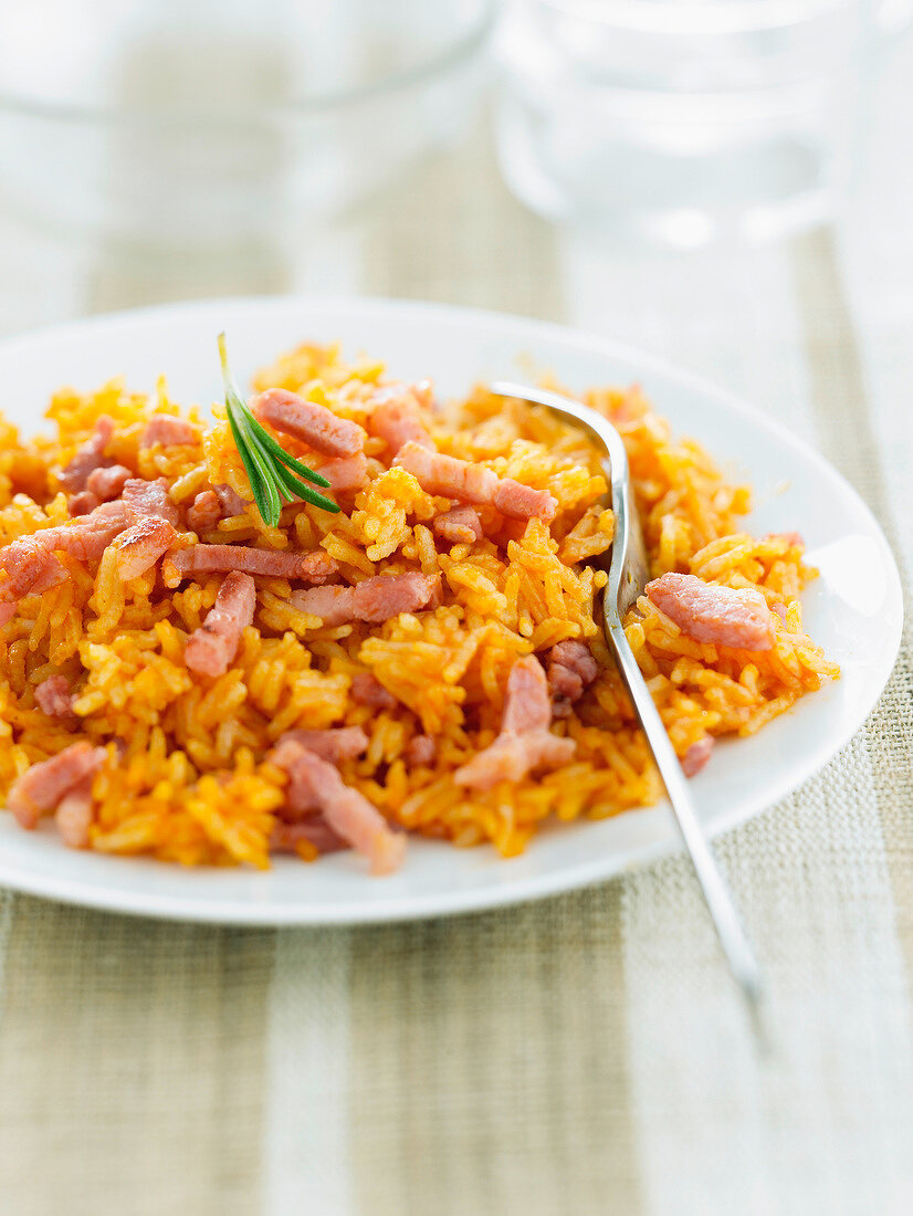Rice with tomato sauce and diced bacon