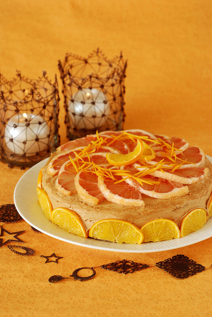 Sponge cake with butter cream and citrus fruit