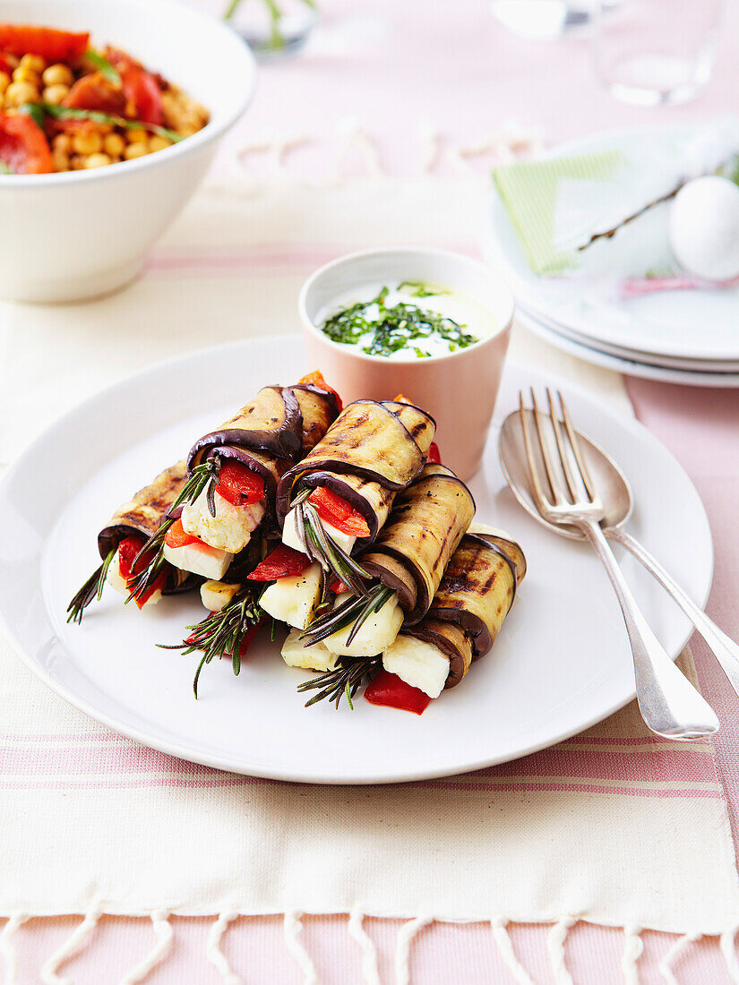 Grilled eggplant rolls stuffed with cheese,red peppers and rosemary