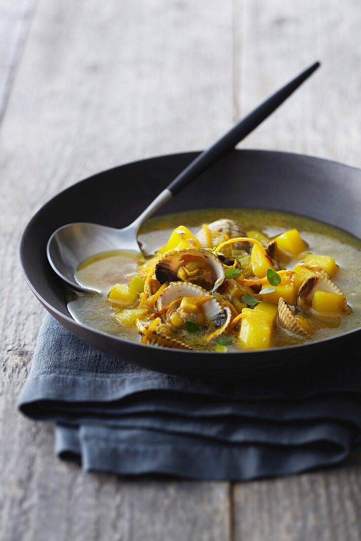 Cockle and orange soup