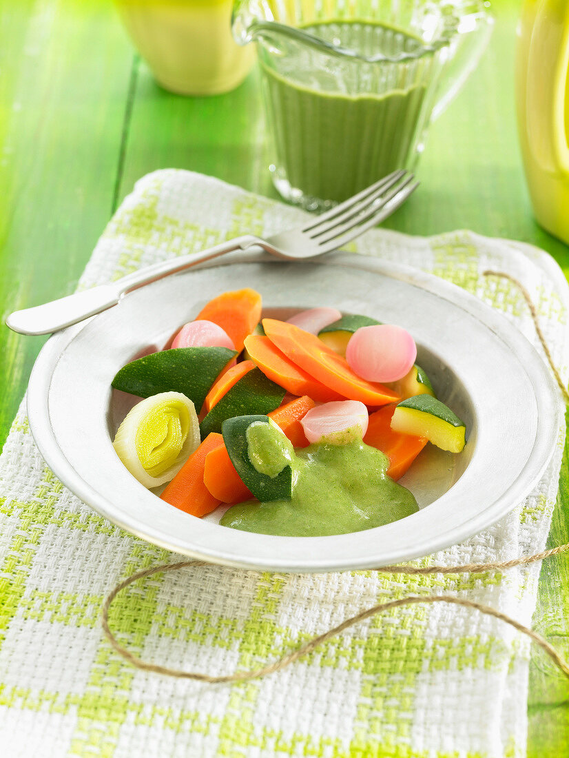 Steamed vegetables with green lentil and coconut milk sauce