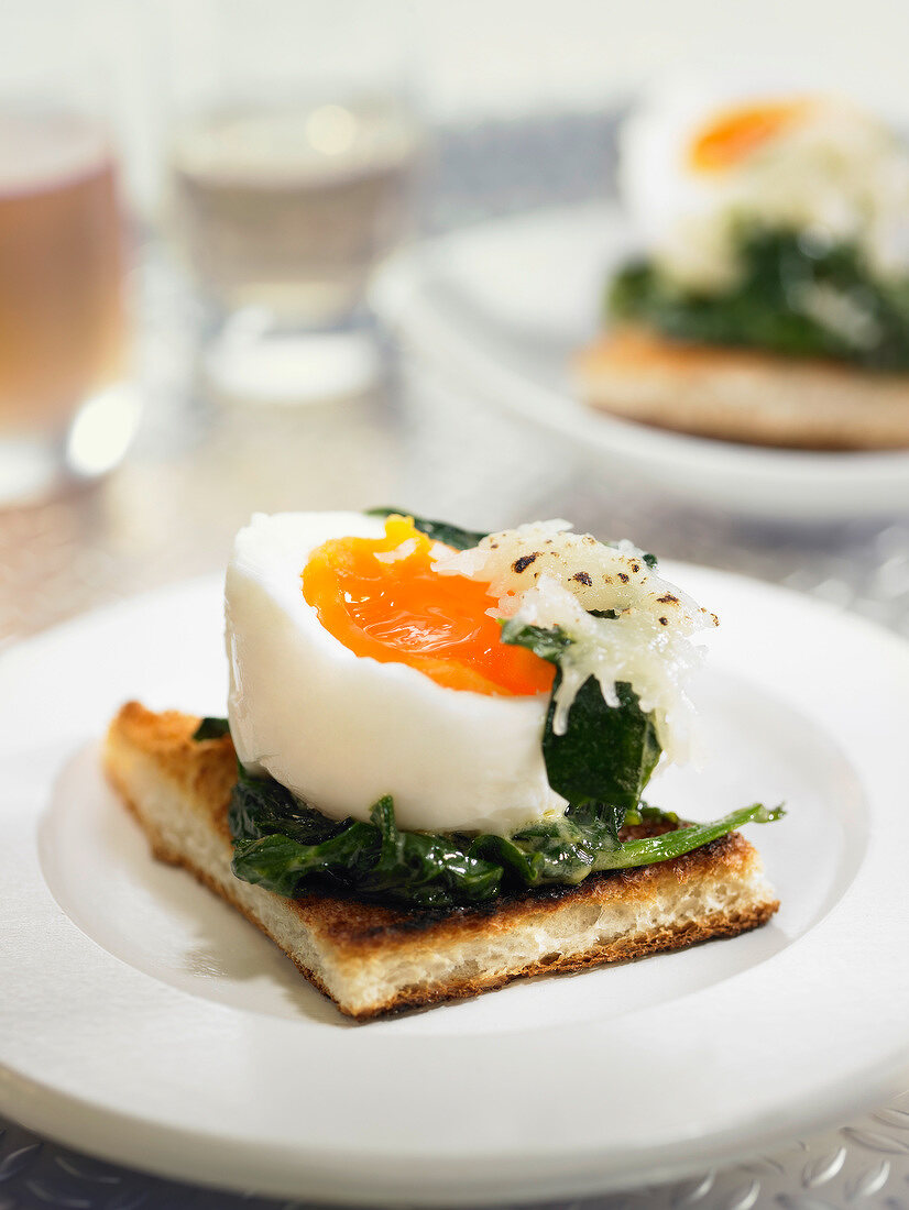 Soft-boiled egg, spinach and grated gruyère on toast