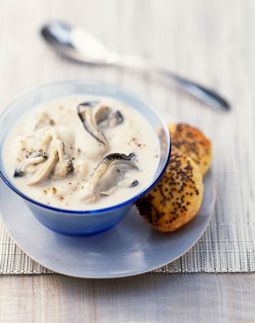 Creamy oyster soup with flaky pastries with poppyseeds