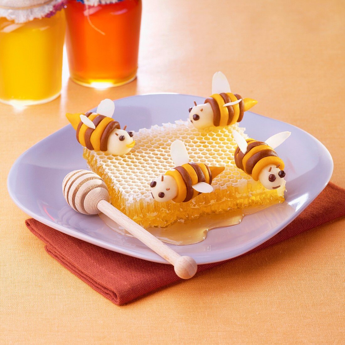 Almond paste bees on a honeycomb
