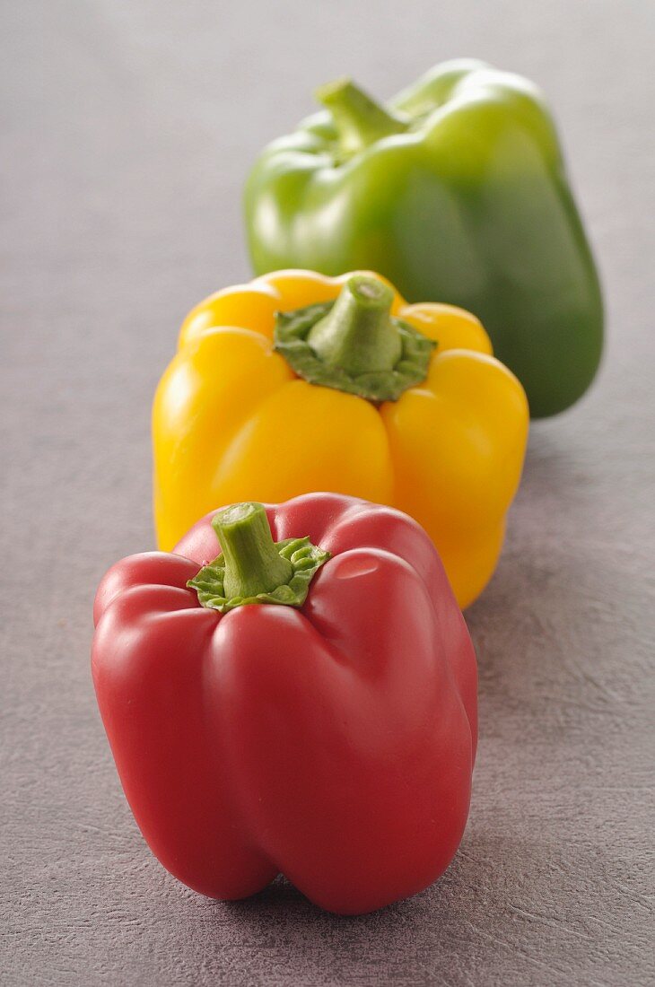 Three different colored bell peppers
