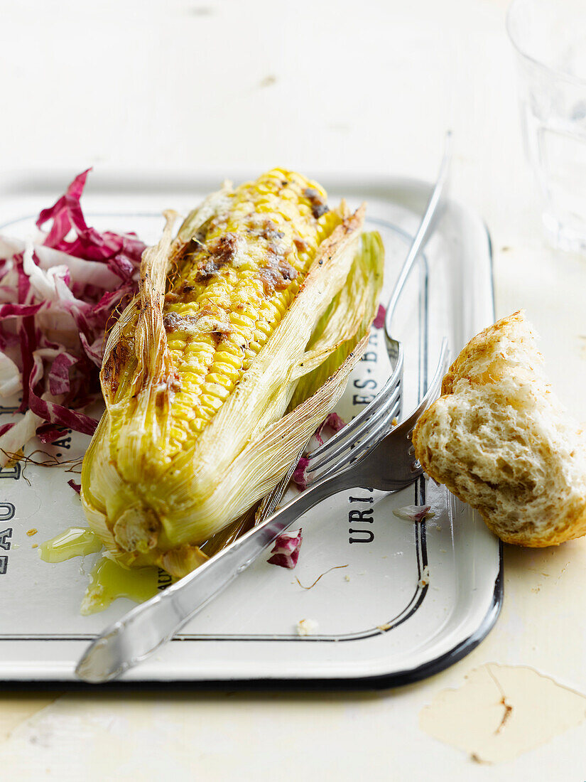 Grilled corn on the cob with anchovy butter