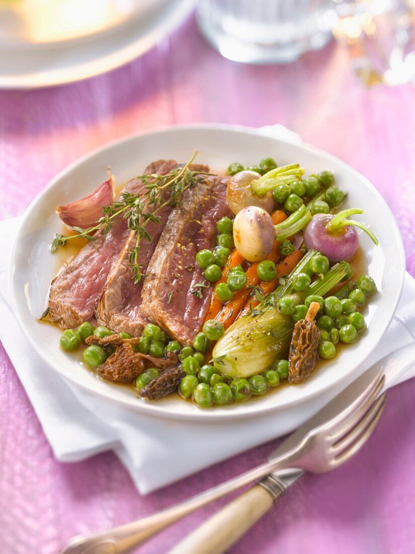 Beef fillet with morel gravy and spring vegetables