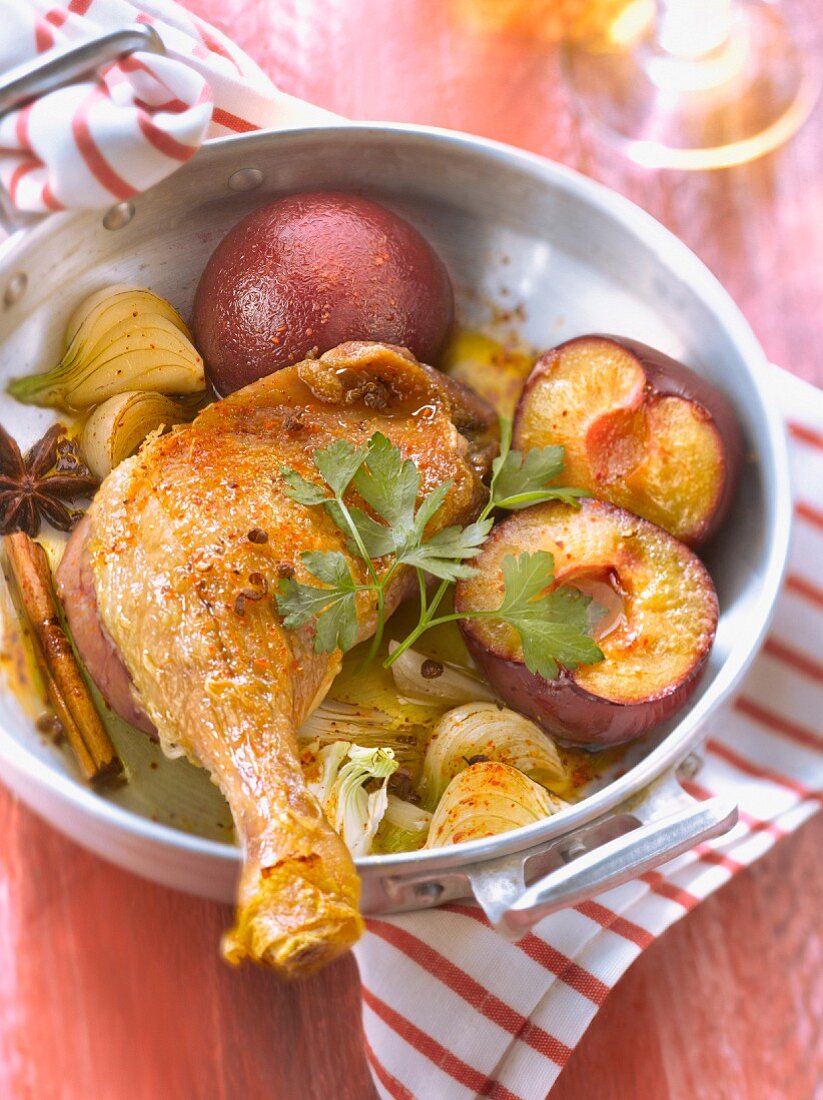 Roasted duck's leg with plums and spicies