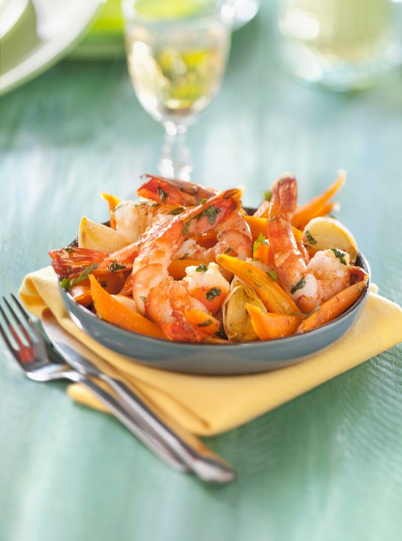 Gambas sauteed with garlic and crisp carrots with honey