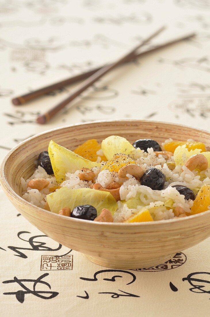 Thai rice salad with cashews,oranges,chicory and black olives