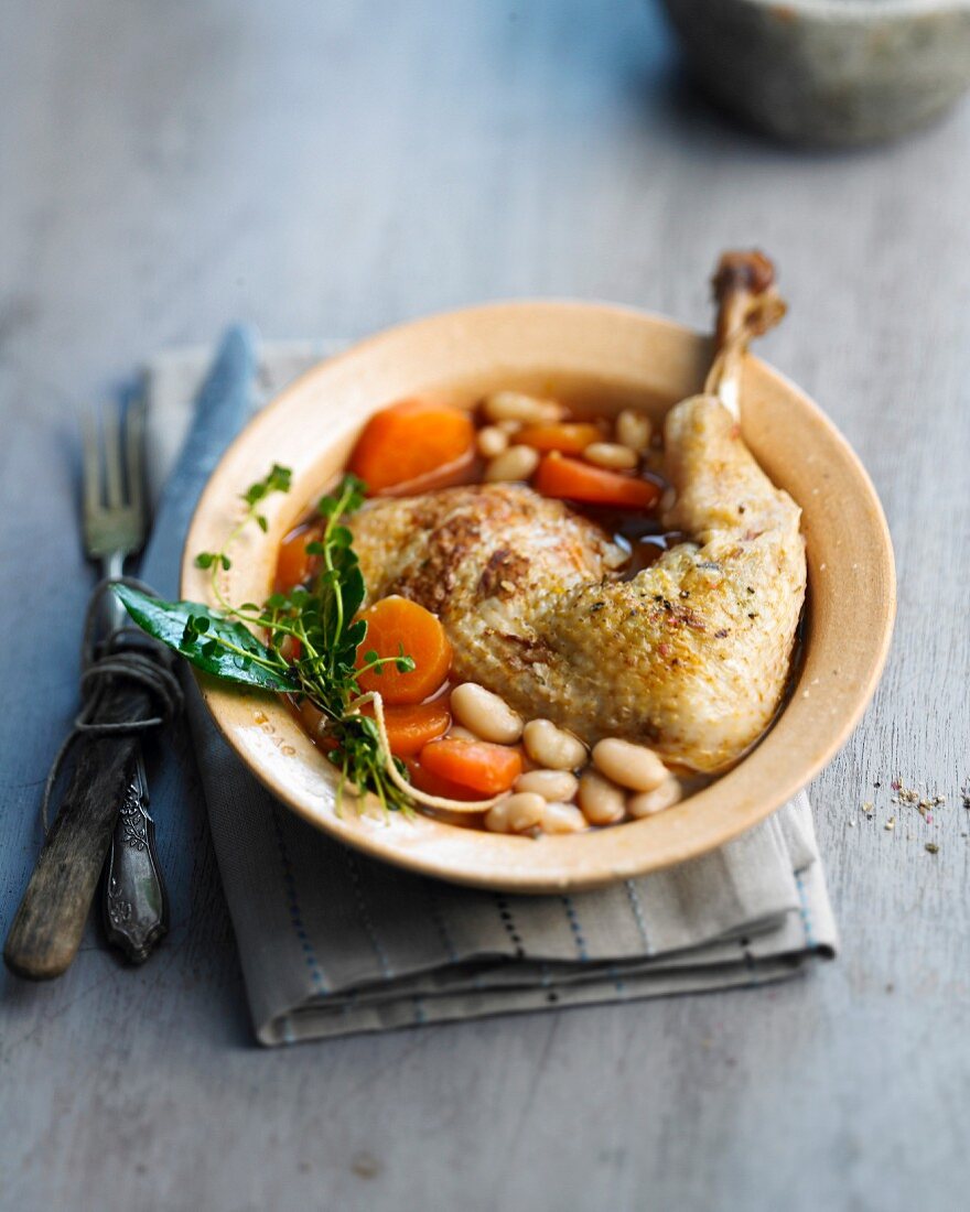 Chicken leg with white beans and carrots