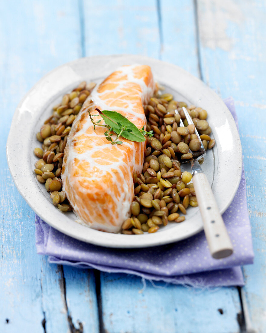 Salmon wrapped in caul with lentils