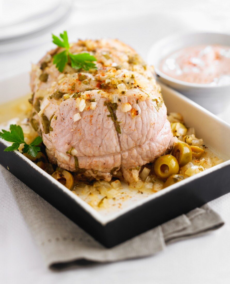 Roast pork with olives, tomato and fromage frais sauce