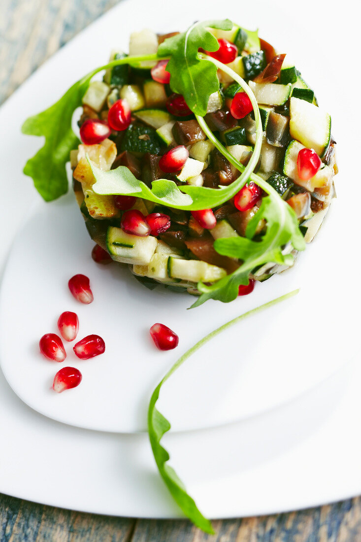Zucchini,eggplant and pomegranate seed Timbale