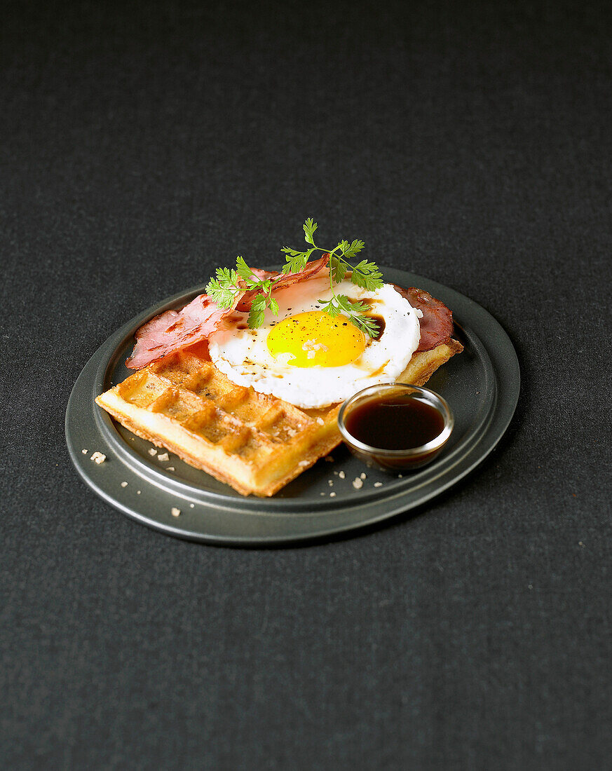 Waffle with fried egg and bacon