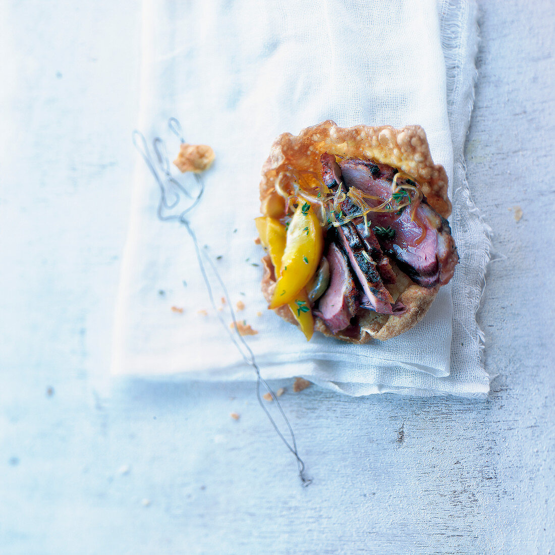 Duck Magret with peaches in a crisp casing
