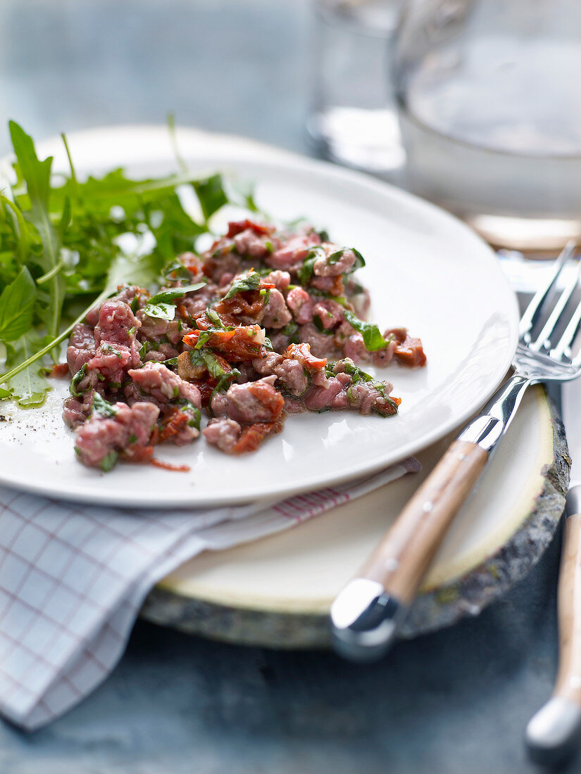 Duck tartare with herbs and confit tomatoes