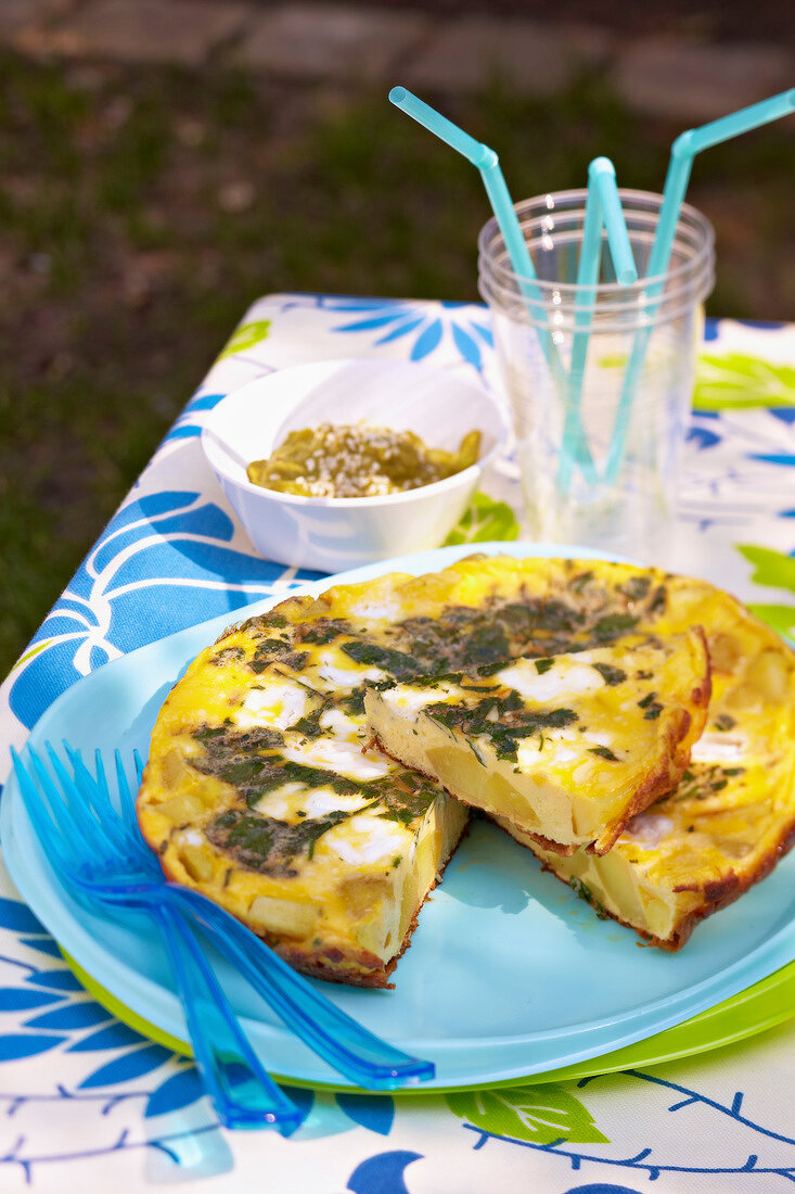 Potato,goat's cheese and cilantro cold omelette with guacamole and sesame seed oil sauce