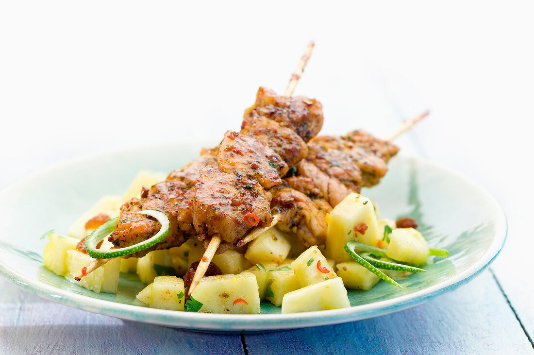Chicken and pork brochettes with pineapple salad