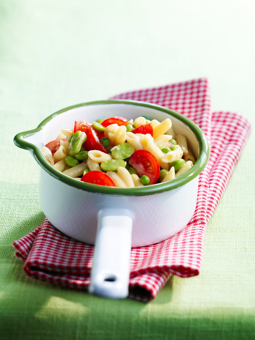 Pasta with cherry tomatoes , flageolet beans and peas