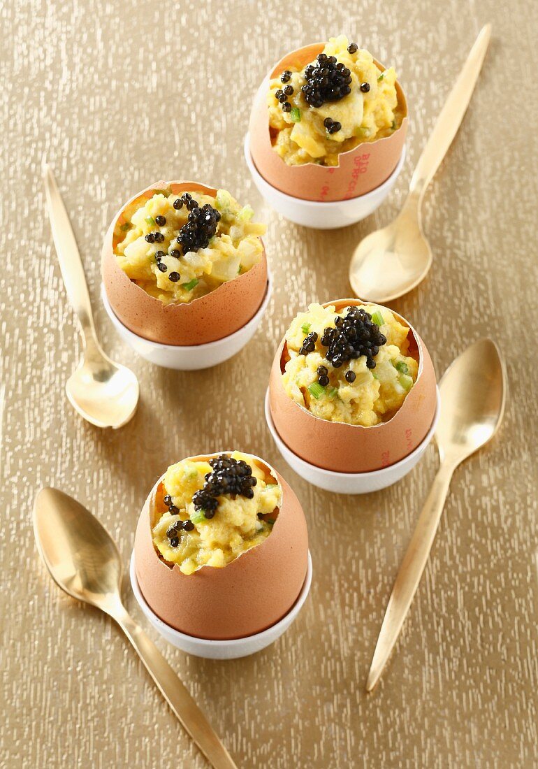 Scrambled eggs with fish roe served in egg shells