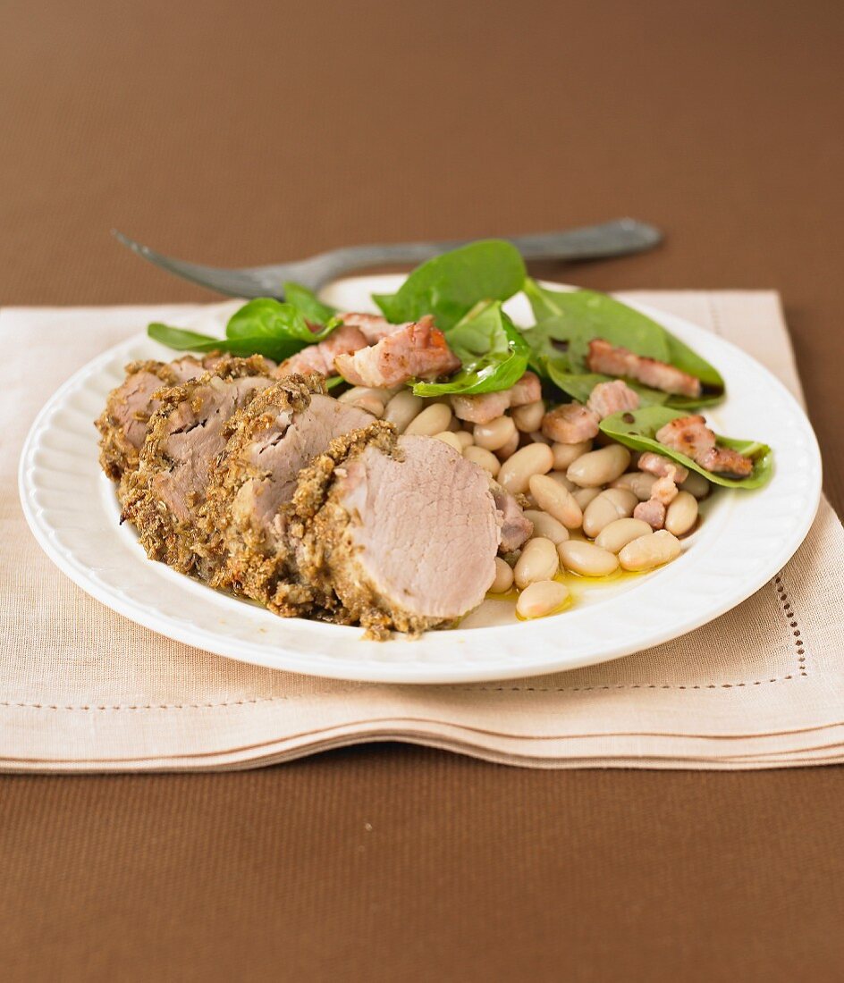 Roast pork in spicy crust with white beans
