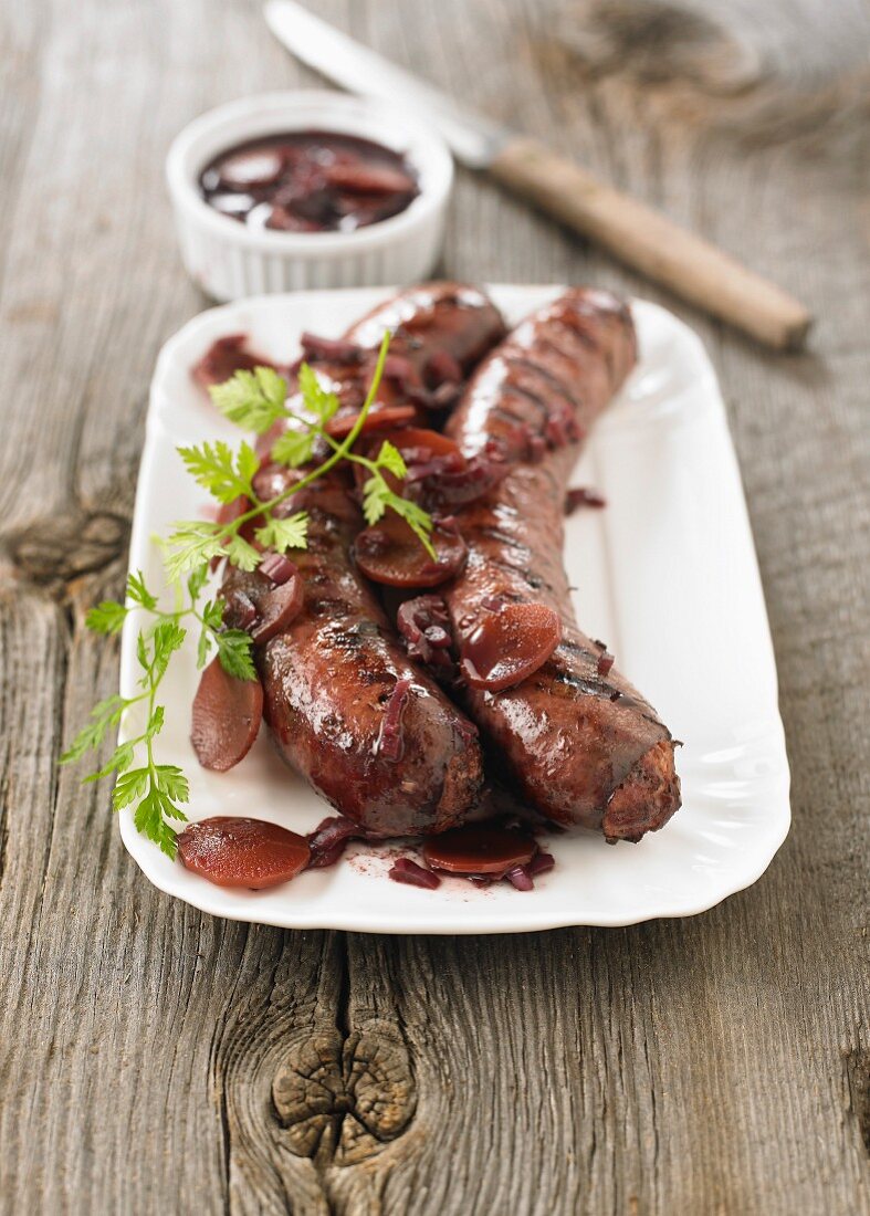 Grilled sausages from Toulouse ,wine,carrot and onion sauce