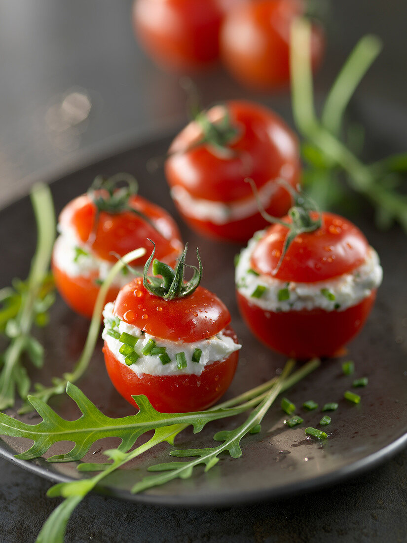 Cherry tomatoes stuffed with cream cheese and herbs