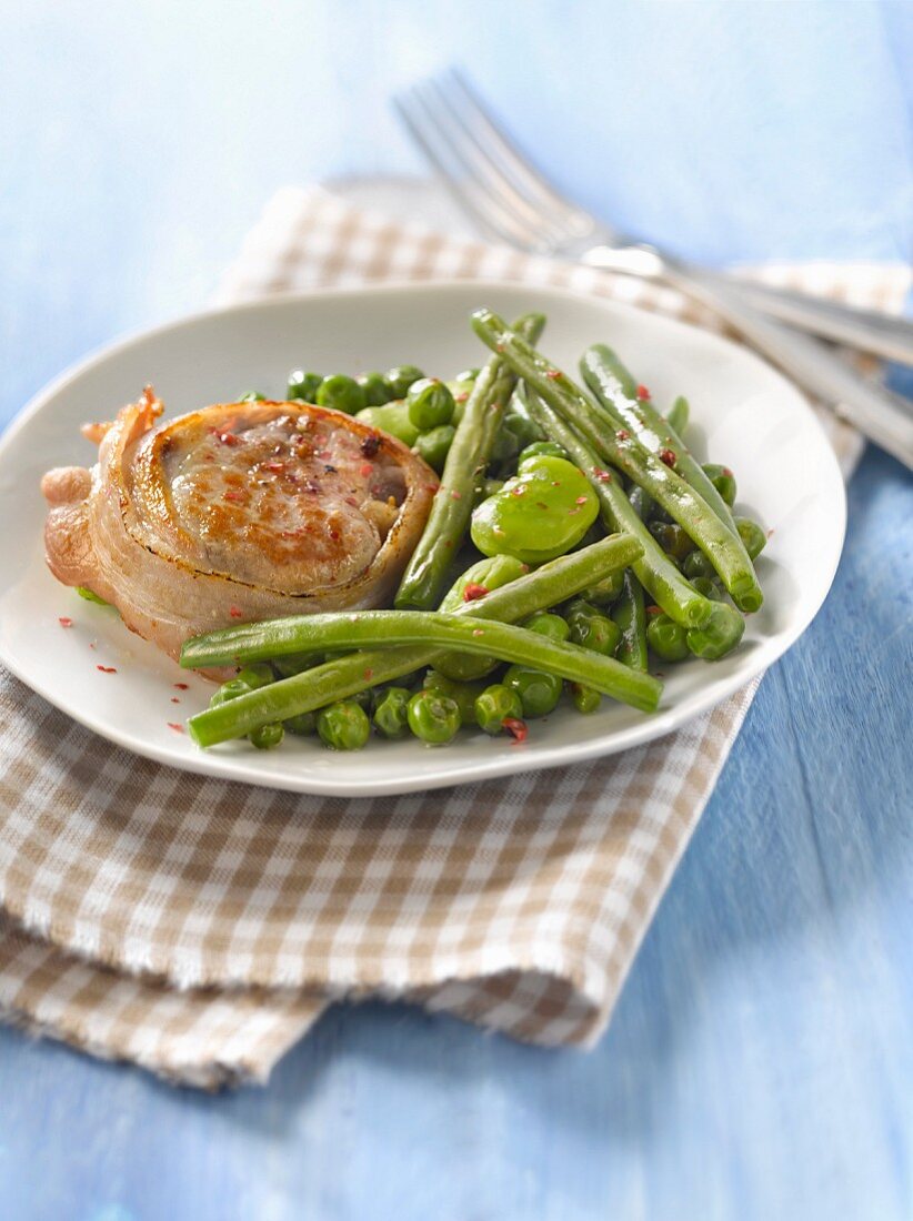 Pork fillet with green beans,peas and broad beans