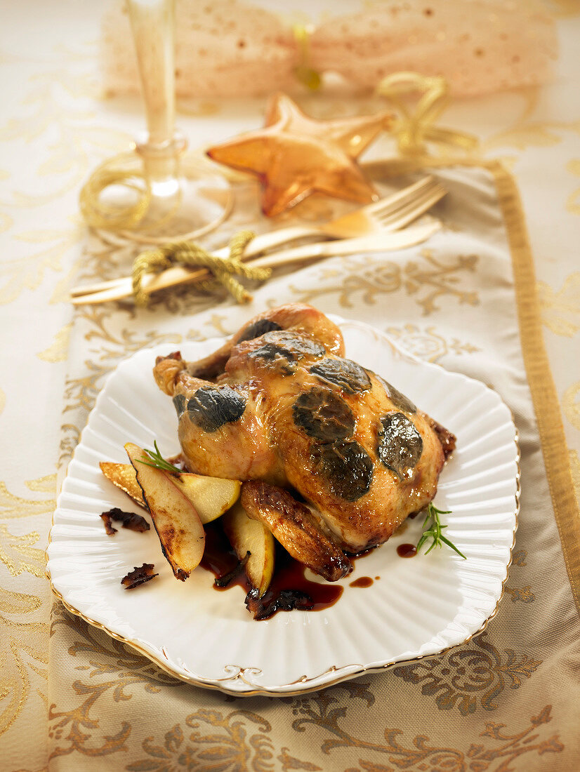 Chicken roasted with sliced truffles under the skin and served with apples