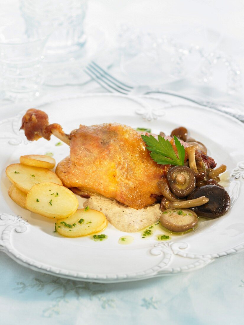 Roast duck with mushrooms and potatoes
