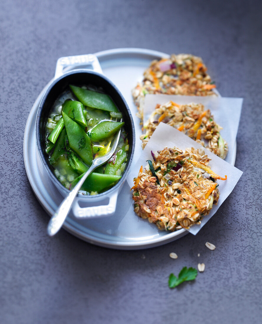 Spicy oatmeal and vegetable cakes with saffron runner bean casserole
