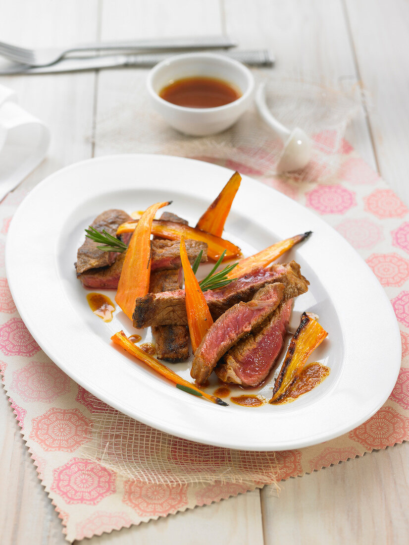Grilled beef with roasted carrots and rosemary