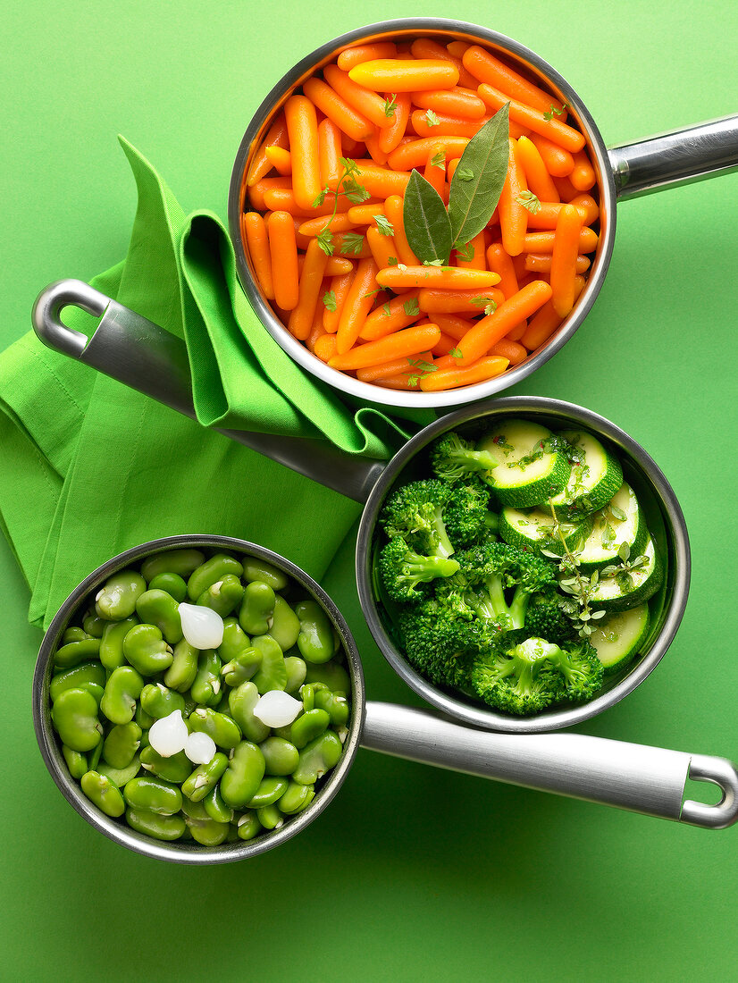 Saucepans of different vegetables