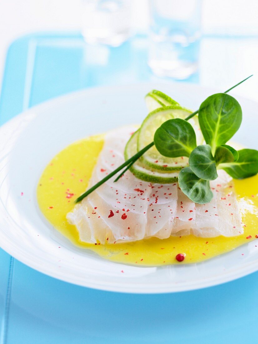 Cod carpaccio with lime juice and pink peppercorns