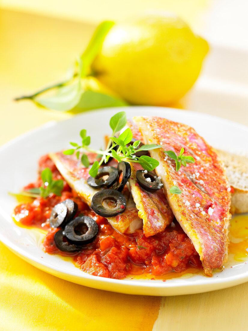 Red mullet fillets with crushed tomatoes and black olives